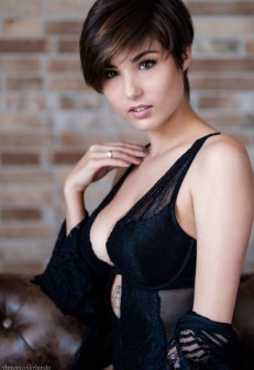 A Brown-Haired Woman with A Short Haircut undresses (83 photos)