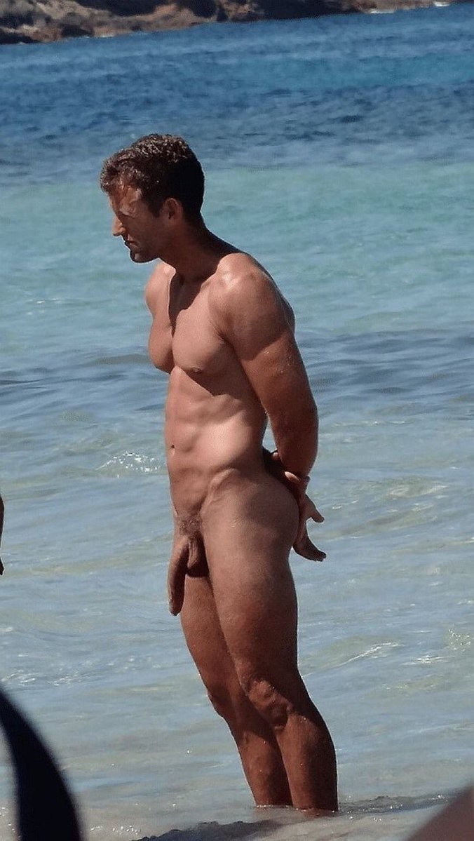 Naked guy on a public beach