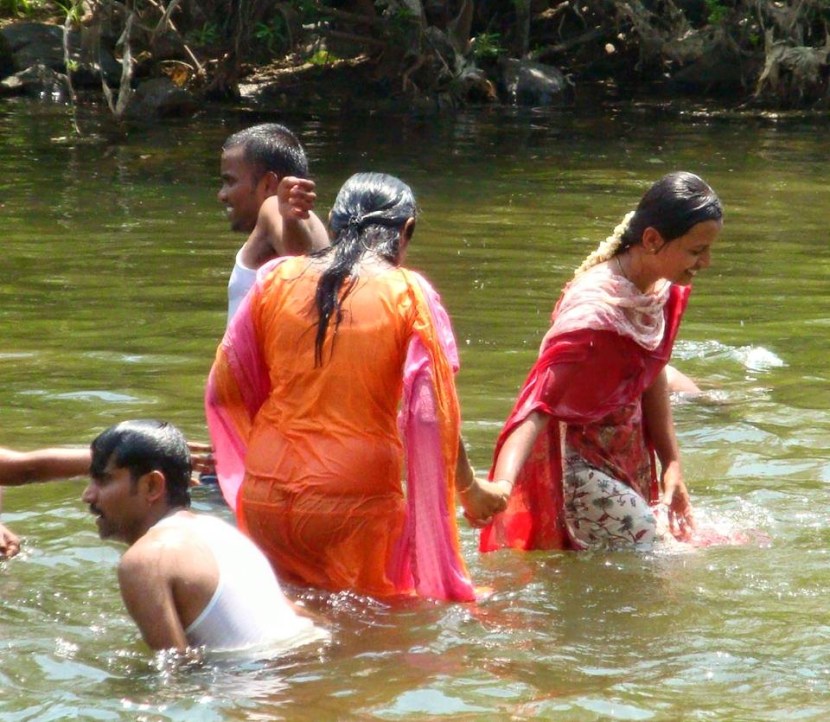 Asian Women Bathing in River