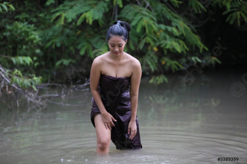 Japanese girl bathes in the river