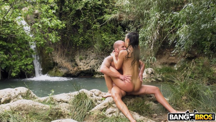 Girl naked at the waterfall