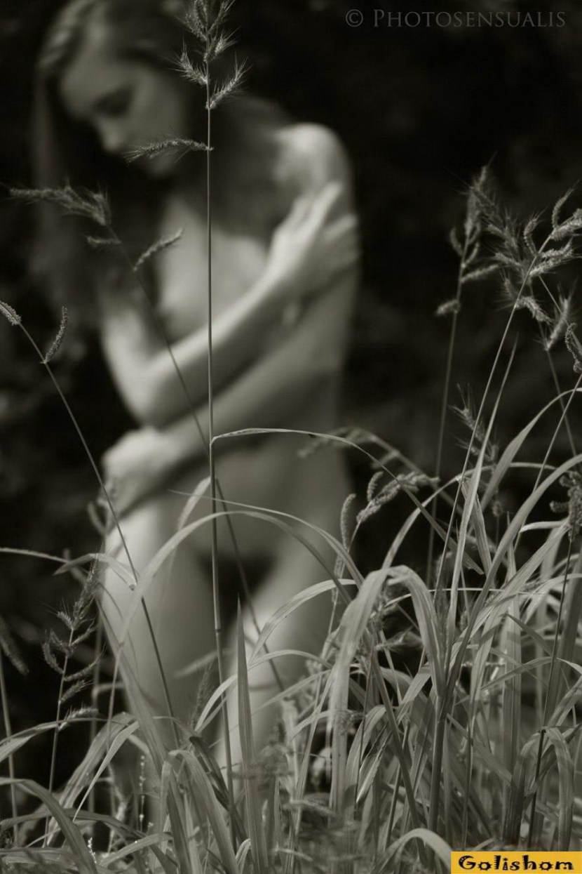 Naga woman lies on the grass