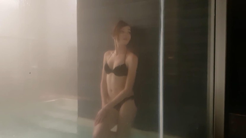 Karina Strimmersha in a swimsuit in a sauna