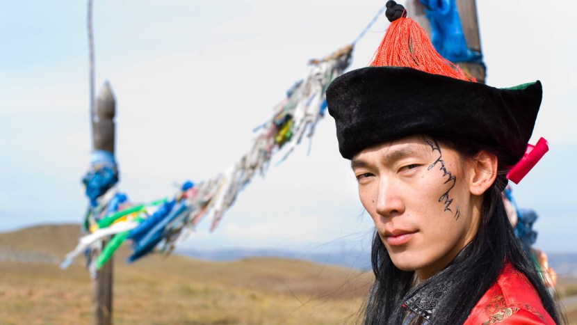 Mongolian young man in a national costume
