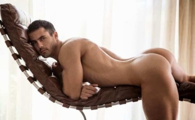 Sexy Nude Male Model Laying Back in Big Bed