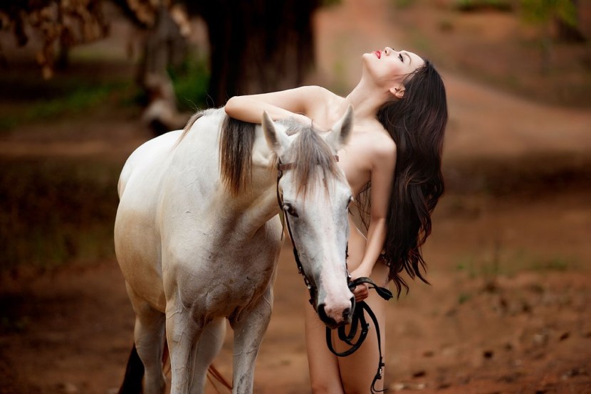 Photo shoot with horses in the style of nude