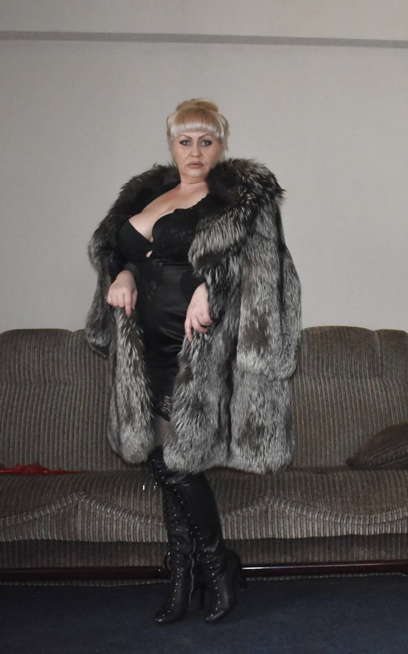 A man in a female fur coat