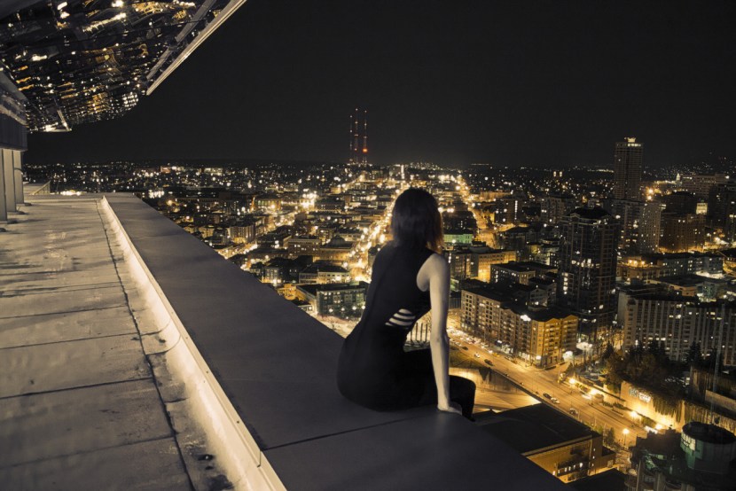 Girl on the roof of the night city