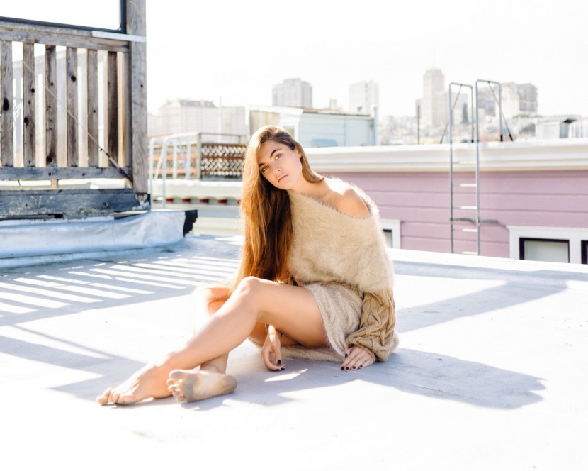 Girl barefoot on the roof