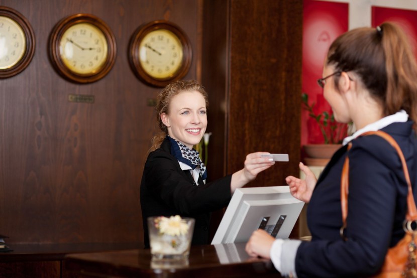 Receptionist in red uniform