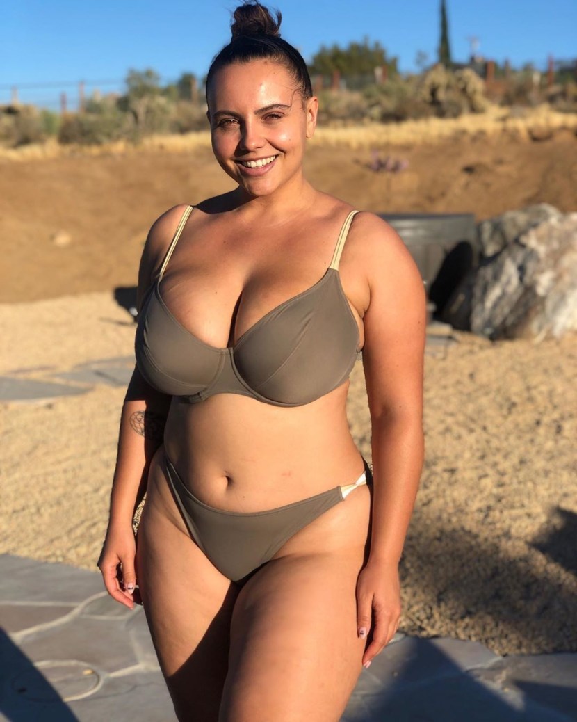 Young pier in a swimsuit