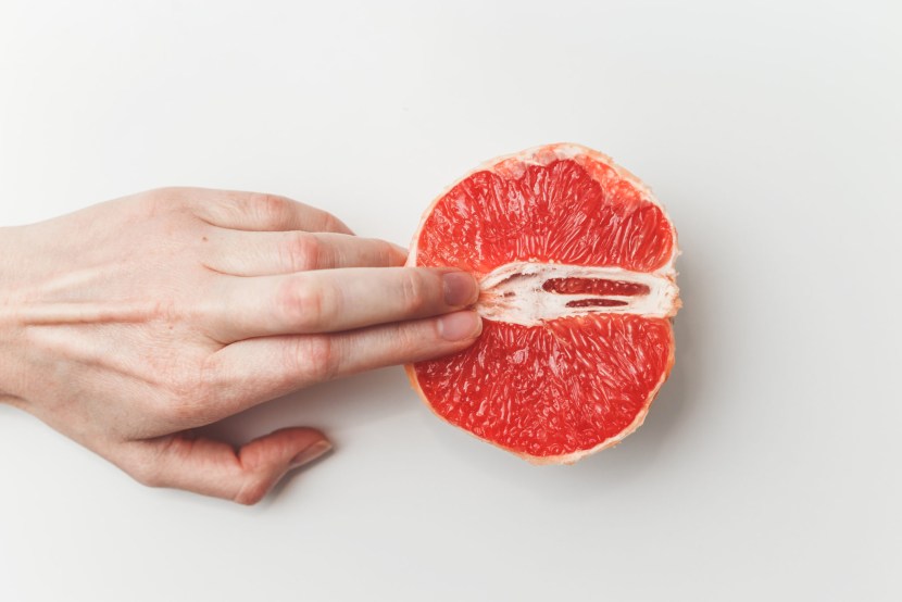Fingers in grapefruit