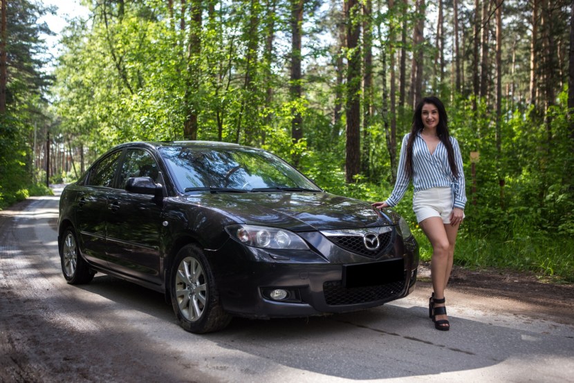 Mazda 3 with a girl
