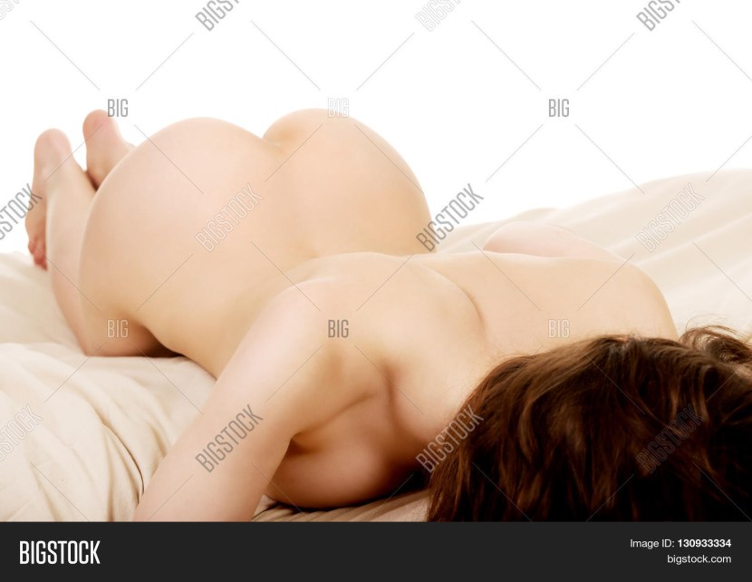 Naked woman lies on her stomach