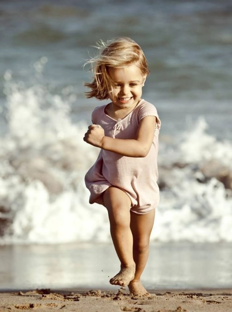 The child is blowing soap bubbles