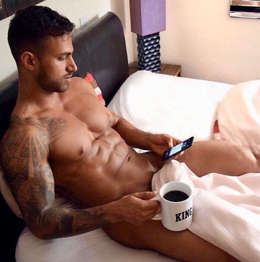 Naked man with a cup of coffee