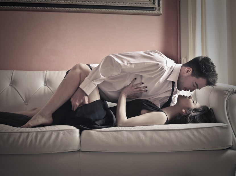 Passionate kiss on the couch