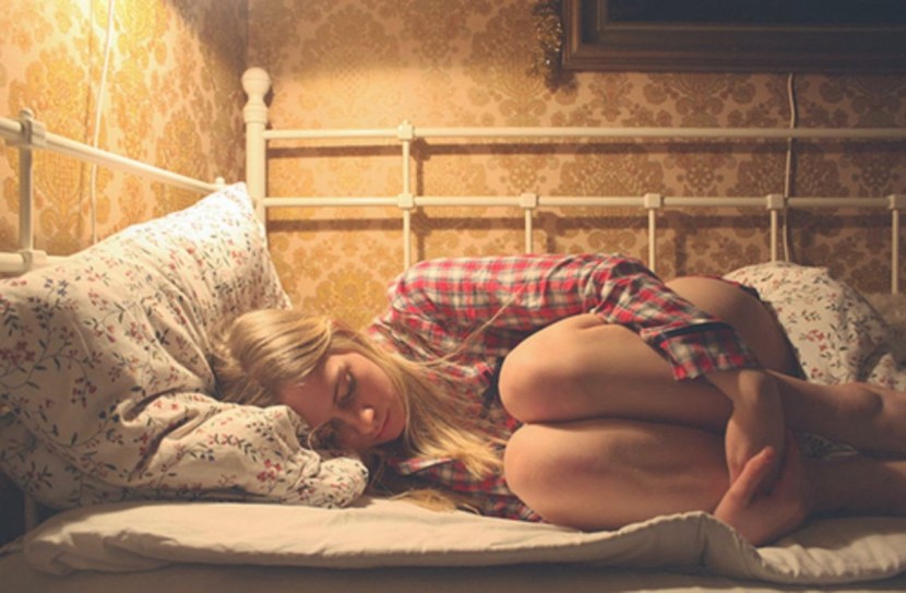 The girl sleeps naked