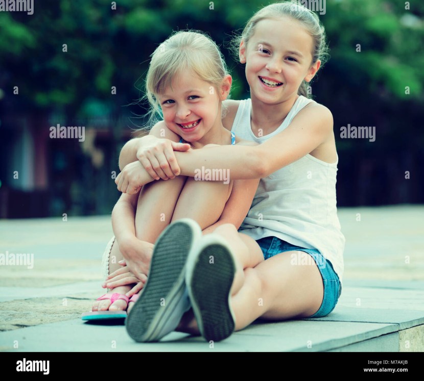 Two Smiling Little Sisters Embracing Video Photo Bank Lori