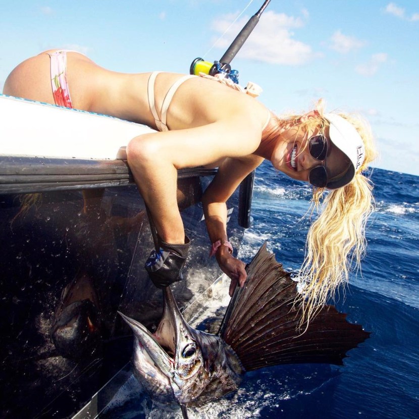 Naked woman with big boobs on fishing