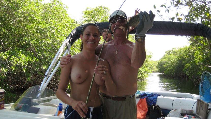 Naked brunettes fishing