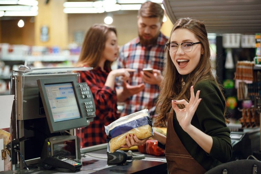 Woman at the checkout in the store