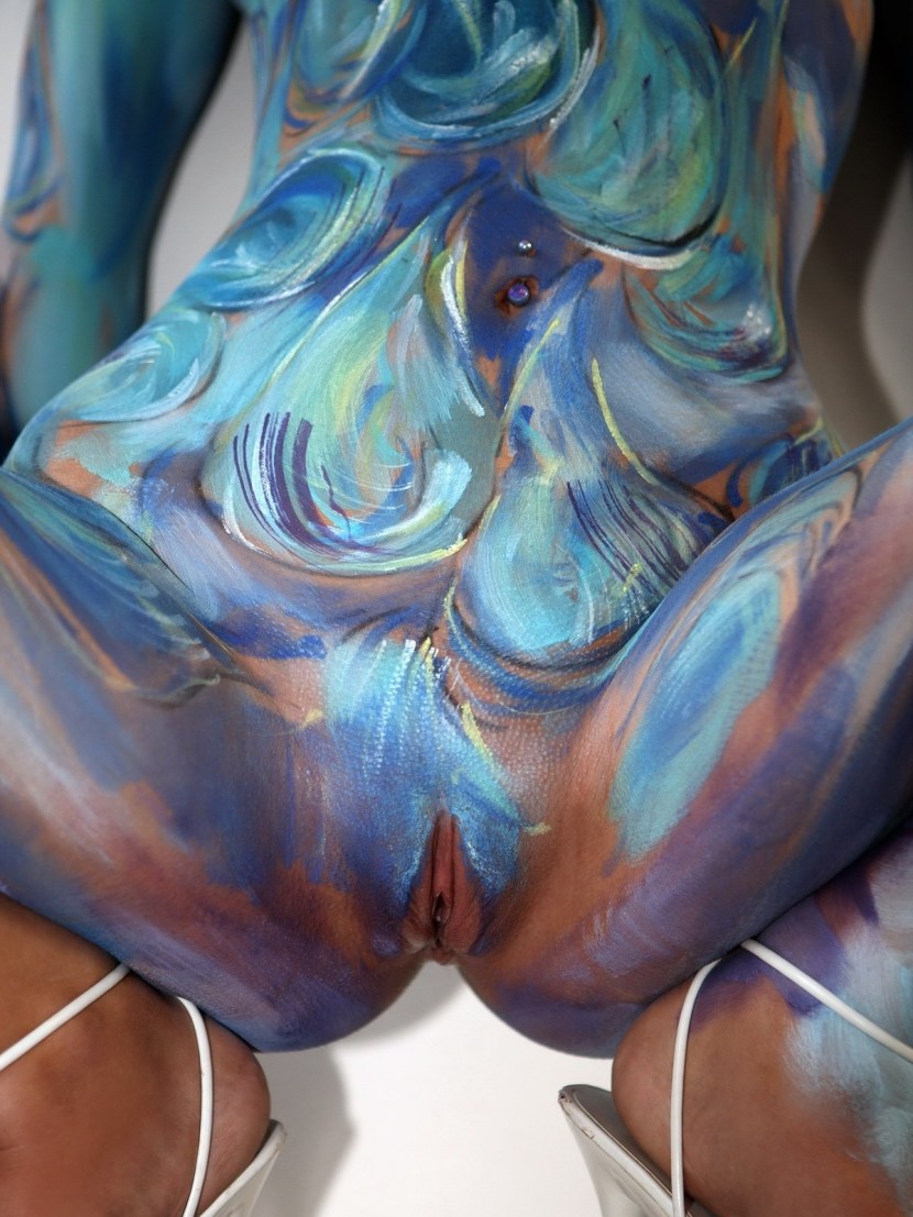 Naked women painted with paint