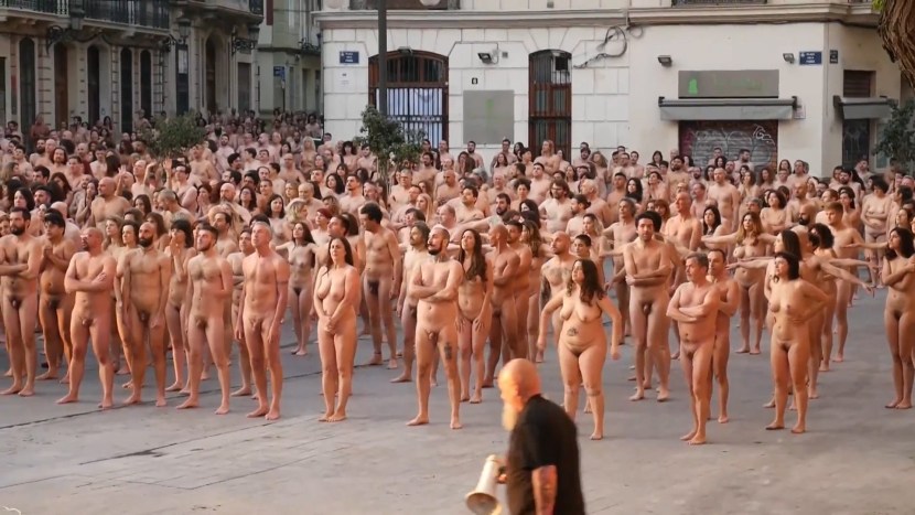 Naked girls among people