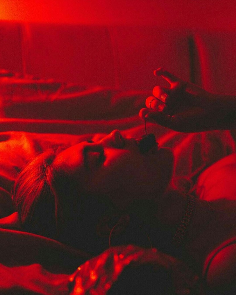 Girl sits in the dark