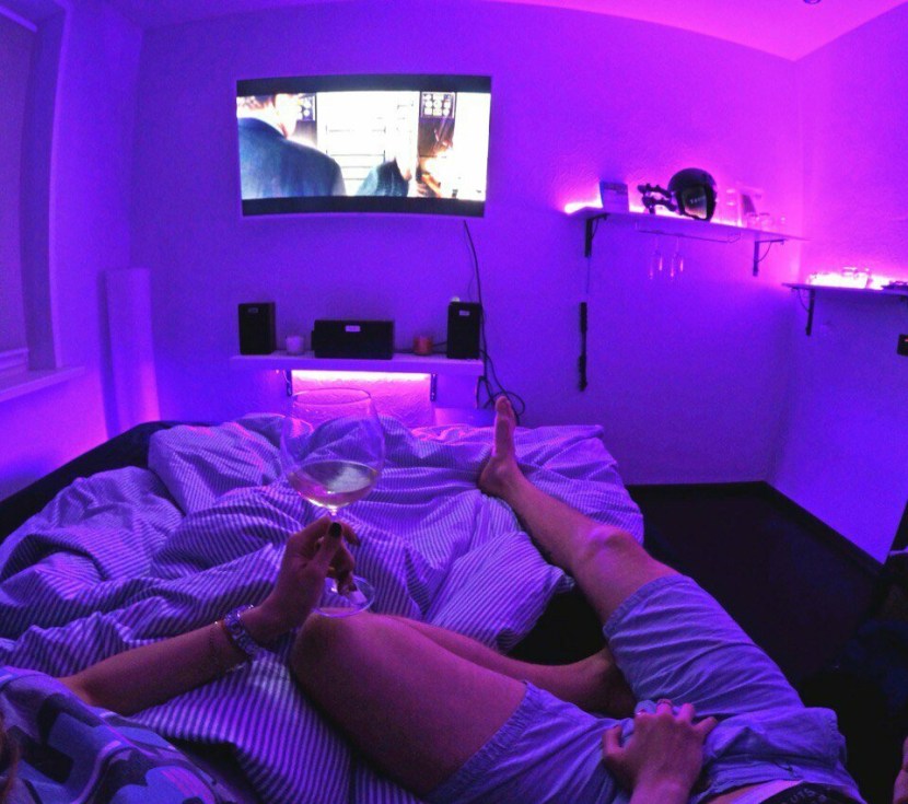 A guy with a girl in bed