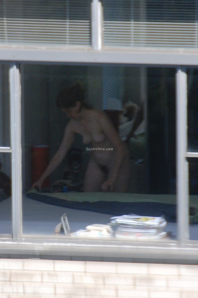 Peeping out the windows behind the naked