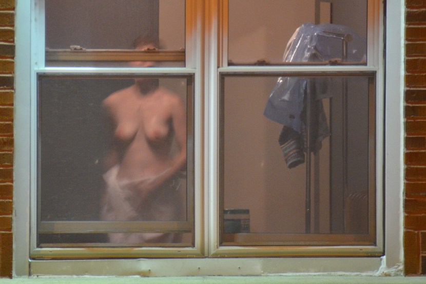 Naked woman through the window