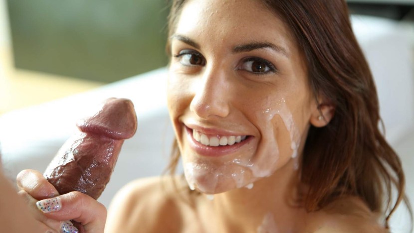 The girl smiles at the penis