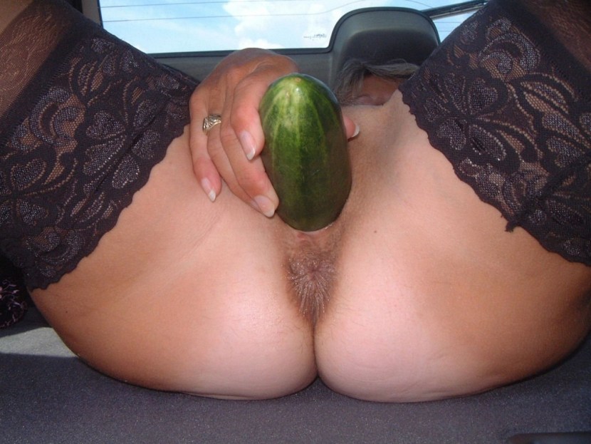 Huge cucumber in the pussy