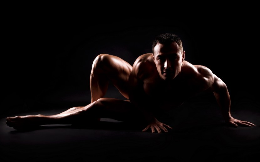Male body on a black background