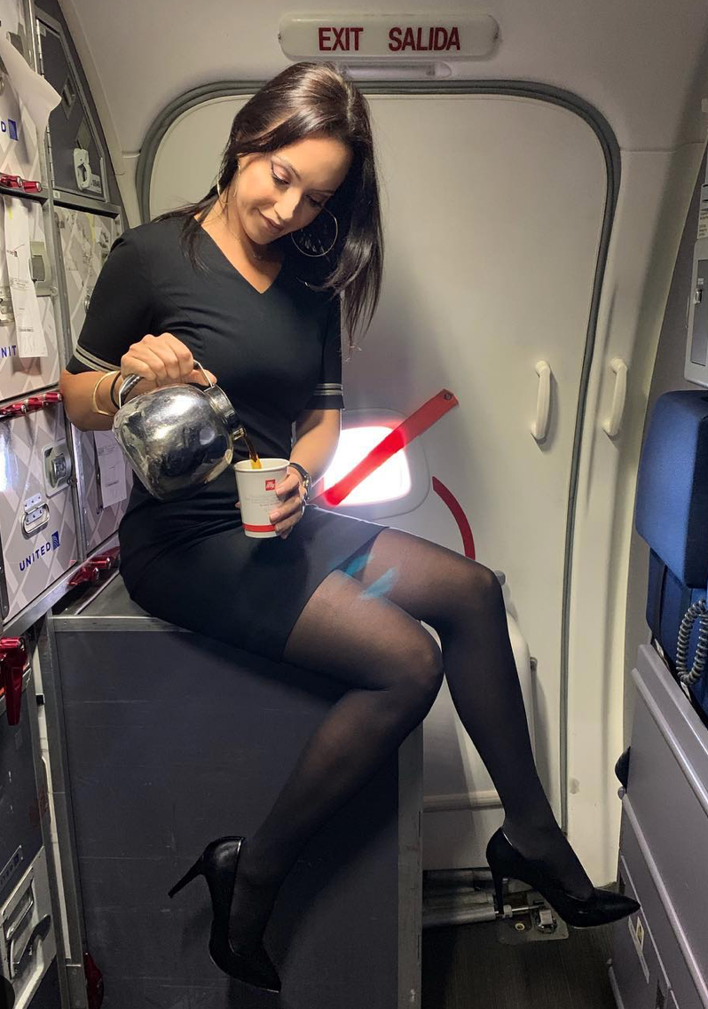 Stewardess in pantyhose without panties