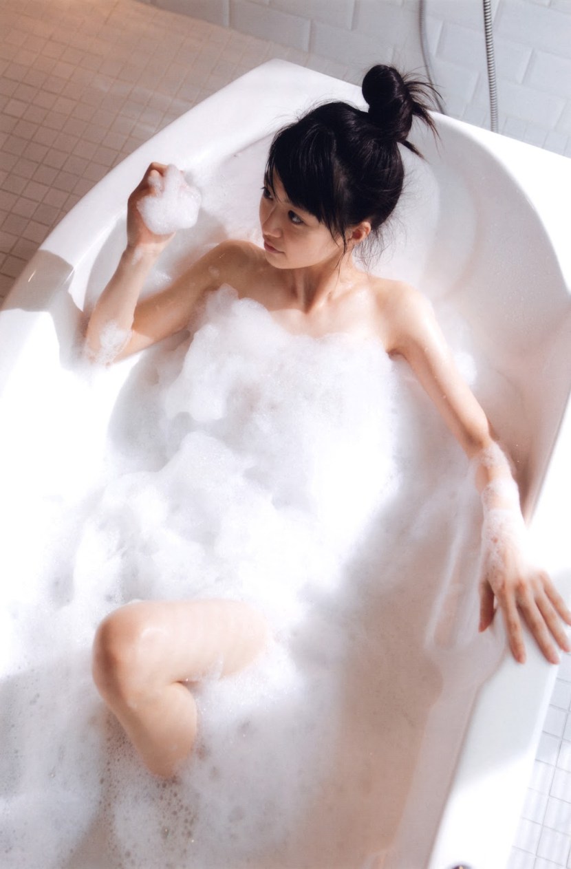 Girl in a bath with foam
