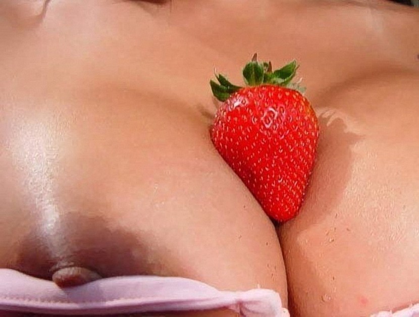 Strawberry in a girl's pussy