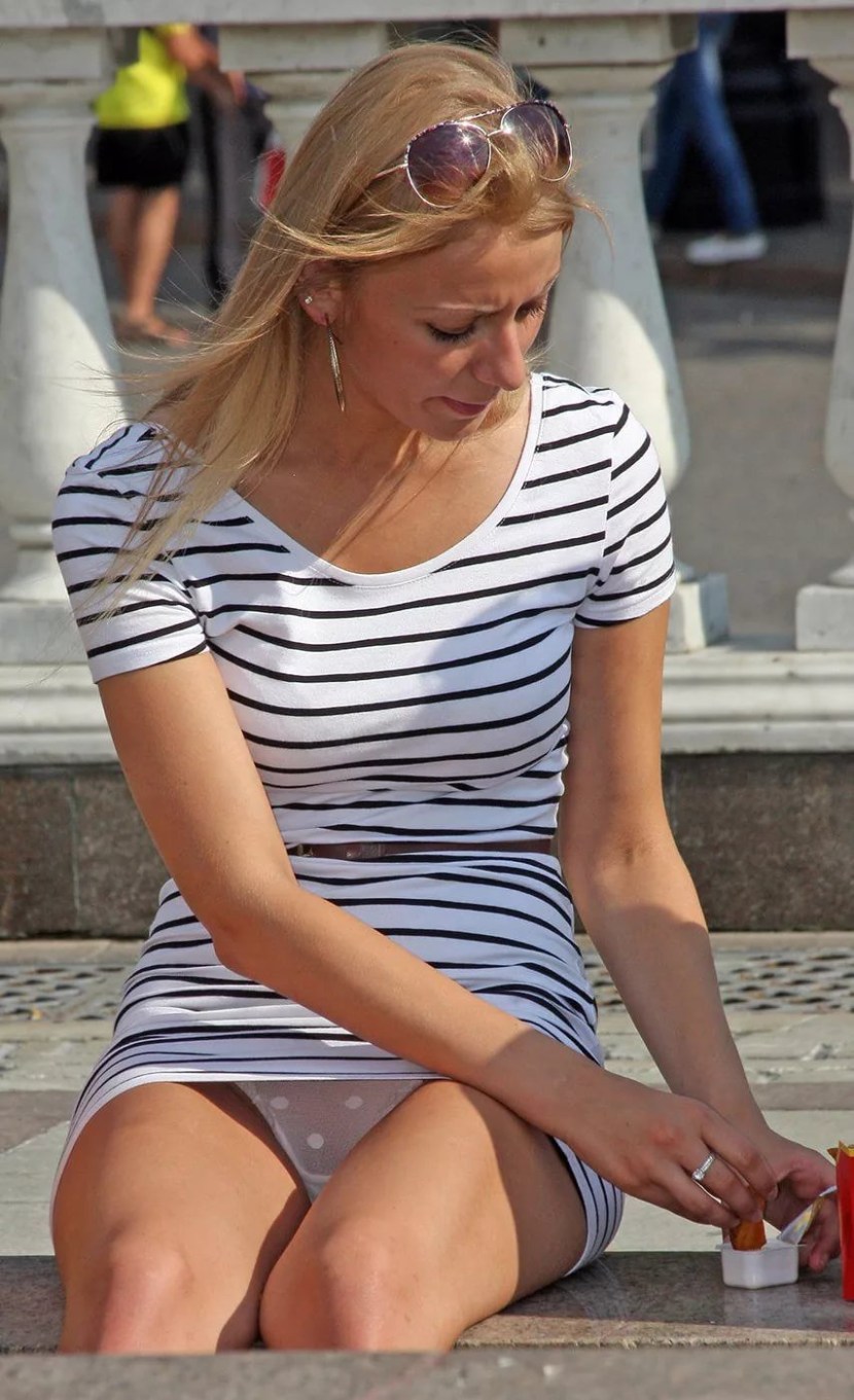 The girl in a short dress bent down