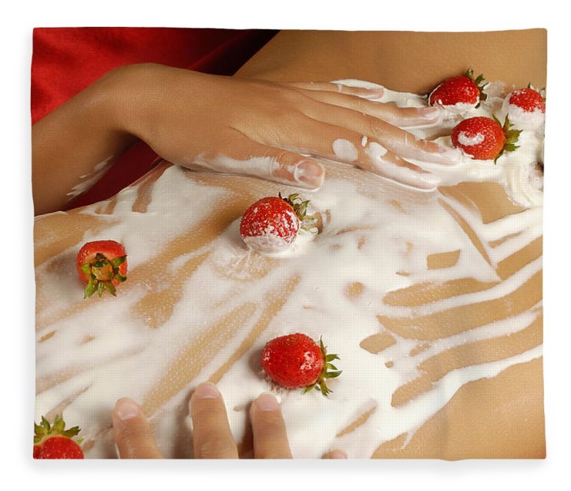 Cream with strawberries on a girl