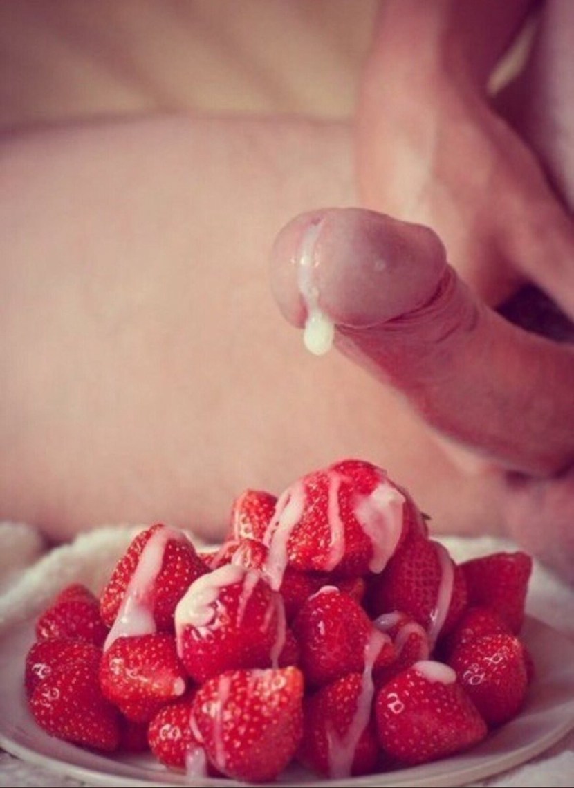 Cream with strawberries on a girl