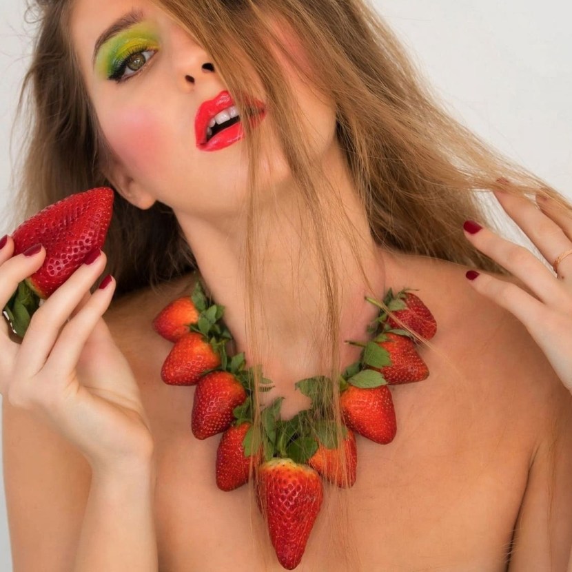 Women's pussy with strawberries