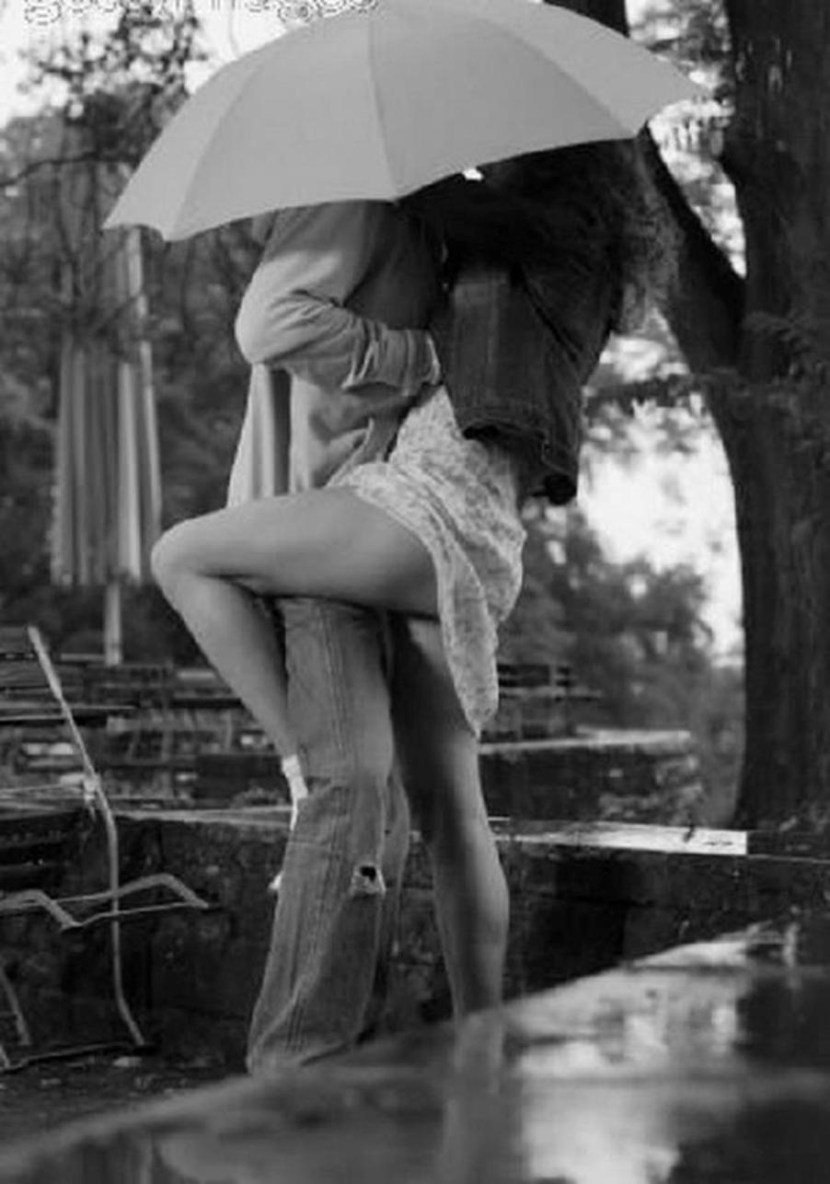 Boy and girl in the rain