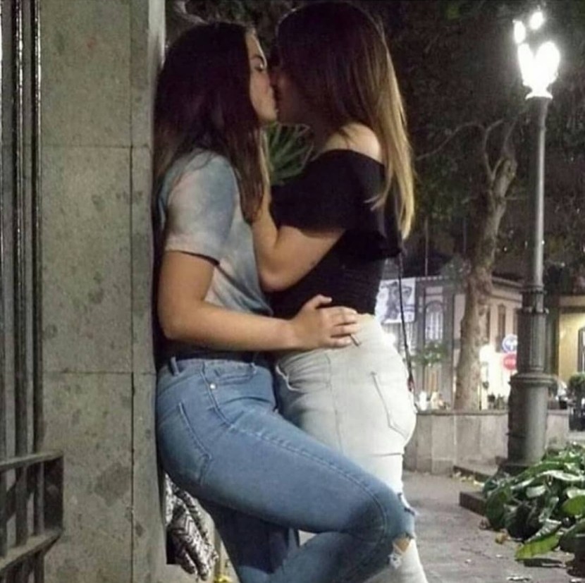 Two girls touch each other