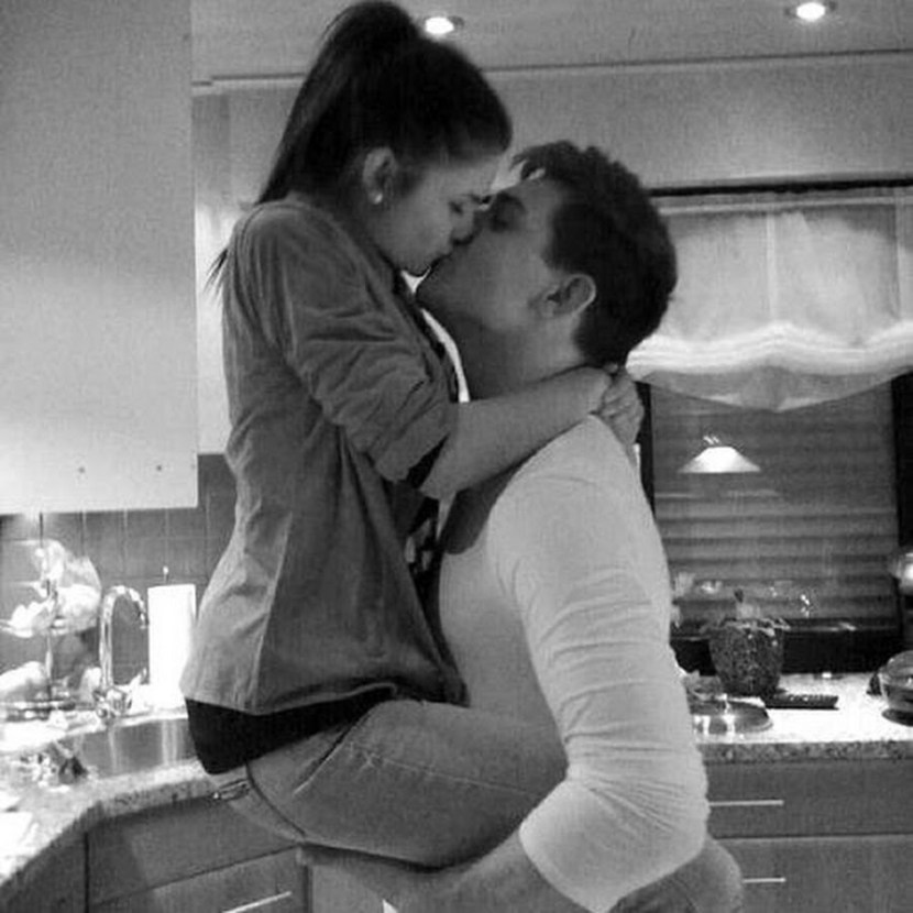 The guy hugs and kisses the girl