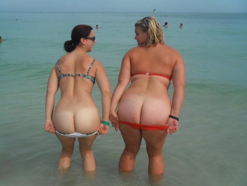 Big naked priests on the beach