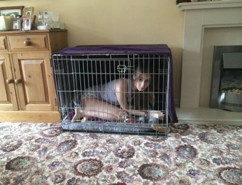 Girl in the dog cage