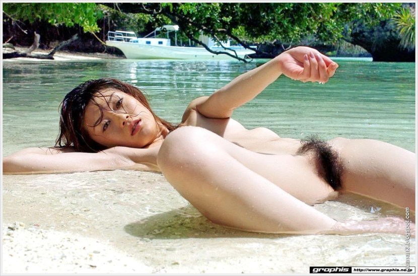 Naked hairy Asian on the beach