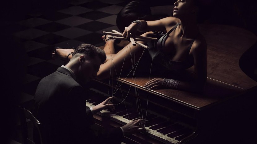 Woman lies on the piano