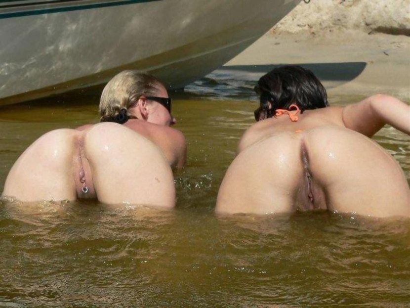 Naked on the beach with bald pussy